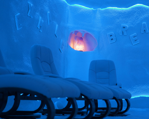 Salt cave seating area with comfortable loungers and salt-covered walls